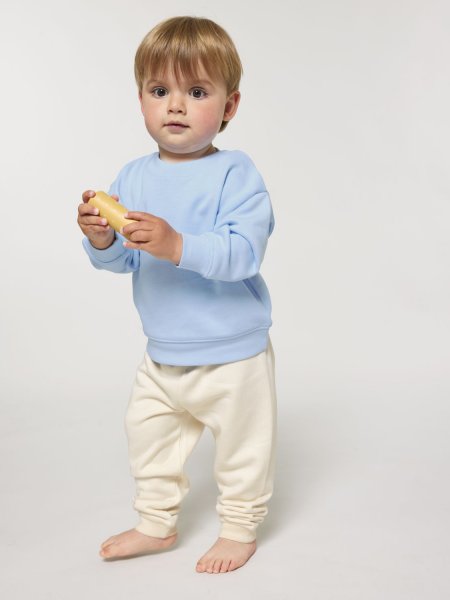 un bébé portant le jogging Baby Tumbler à personnaliser dans le coloris Natural Raw un bébé portant le jogging Baby Tumbler à personnaliser dans le coloris Natural Raw